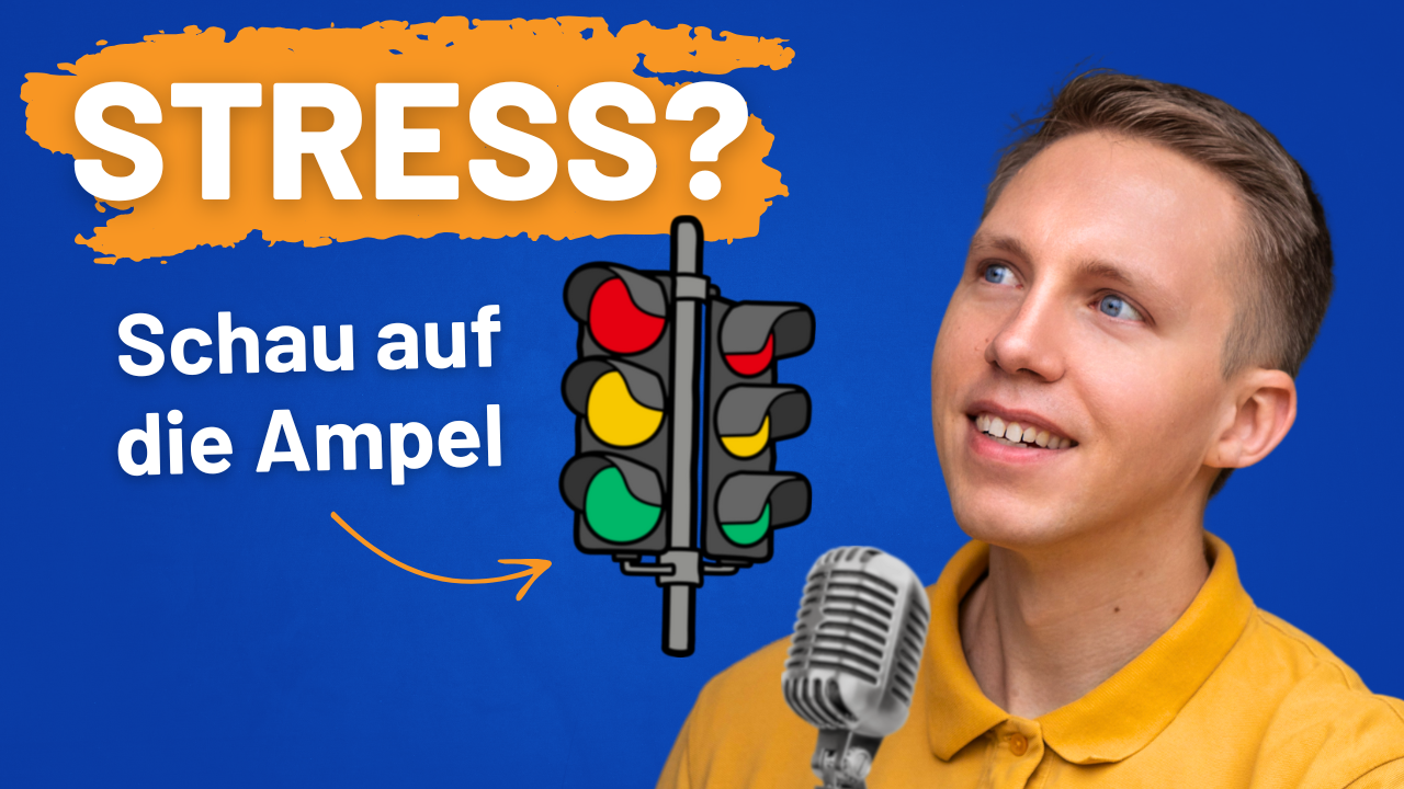 Mann erklärt Stressbewältigung mit einer Stressampel. Schaue auf die Ampel!